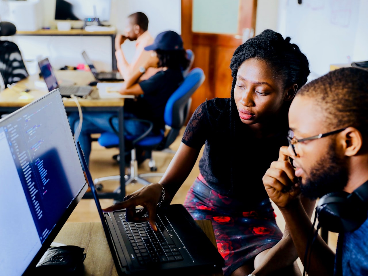 A freelancer presenting portfolio work to a client and explaining the service they offer